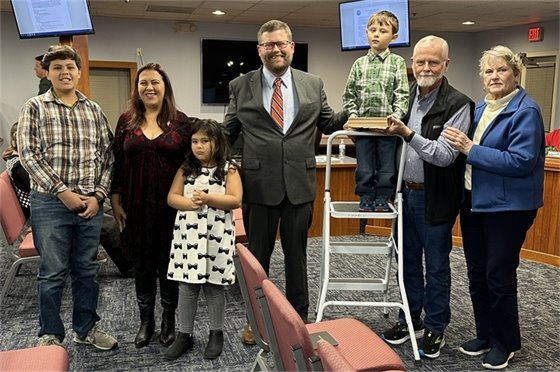 Mayor John Windley accompanied by his family after taking his oath of office. 