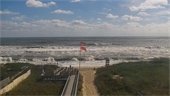 Photo of Kill Devil Hills beach and double red (no swimming) flags flying