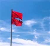 Picture of double red beach warning flags flying 