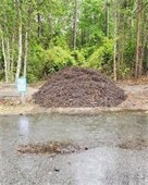 Image of a large pile of mulch: Free Mulch Available! In addition to looking nice, there are many benefits to using mulch in your garden. Mulch nourishes the soil, suppresses weeds, conserves water, regulates root temperatures, and prevents erosion.      Take advantage of the FREE mulch the Town offers while supplies last!     Mulch is available at our Dry Trash Drop Off and Recycle Center (DTDC) and at Aviation Park. Please help yourself to what you need.      The DTDC is located at 701 Bermuda Bay Boulevard. The hours of operation are 8:00 a.m. - 4:00 p.m. Monday - Friday, and 8:00 a.m. - 2:00 p.m. Saturday. Aviation Park is located at 103 Veterans Drive. Stop by there anytime! 