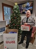 Asst. Chief Harris with Toys for Tots donations