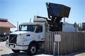 Image of a trash truck emptying a dumpster